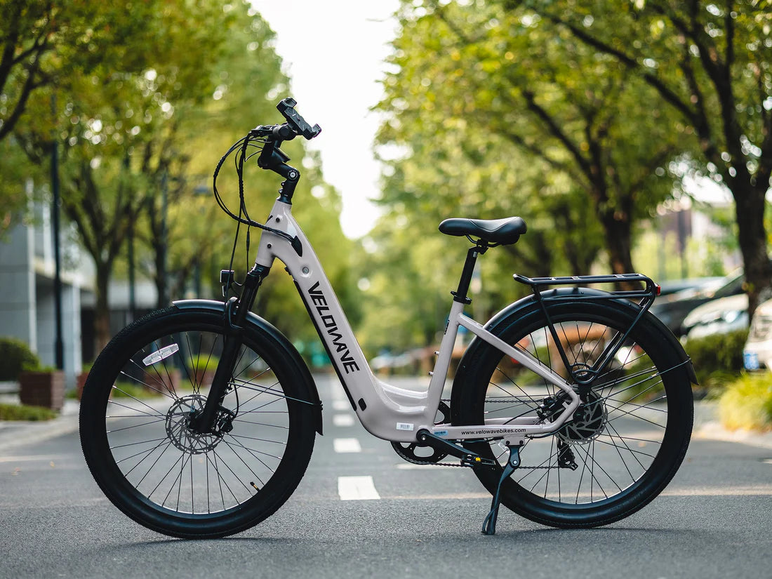 Velowave Breeze T Torque Sensor Electric Bike Electric bike on a road with trees in the background. Valowave Breeze T Torque Sensor Electric Bike