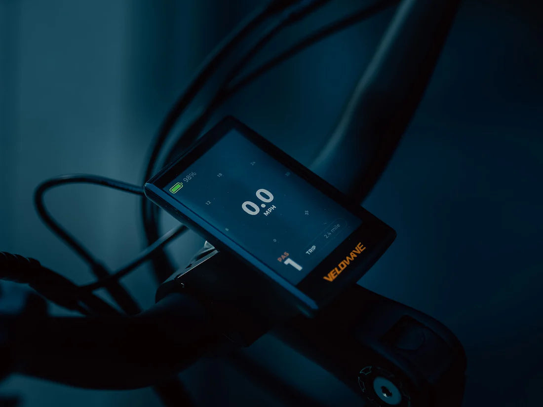 Velowave Breeze T Torque Sensor Electric Bike Digital device with a screen displaying numbers on a dark background. Valowave Breeze T Torque Sensor Electric Bike