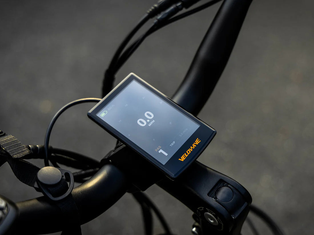 Velowave Breeze T Torque Sensor Electric Bike Bicycle handlebar with digital display and Velovane branding on a blurred background. Valowave Breeze T Torque Sensor Electric Bike