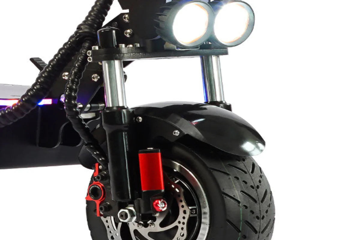 Freego D11 Landtiger Electric Scooter Foldable Dual Motor 4000W Close-up of a motorcycle with prominent headlights and red accents on a white background. Freego D11 Landtiger Electric Scooter Foldable Dual Motor 4000W