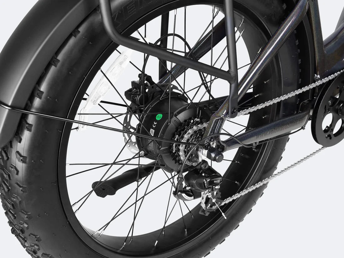 Velowave Ranger Step-Thru 3.0 Torque Sensor Electric Bike Close-up of a bicycle wheel with chain and gear on a white background. Valowave Ranger Step-Thru 3.0 Torque Sensor Electric Bike