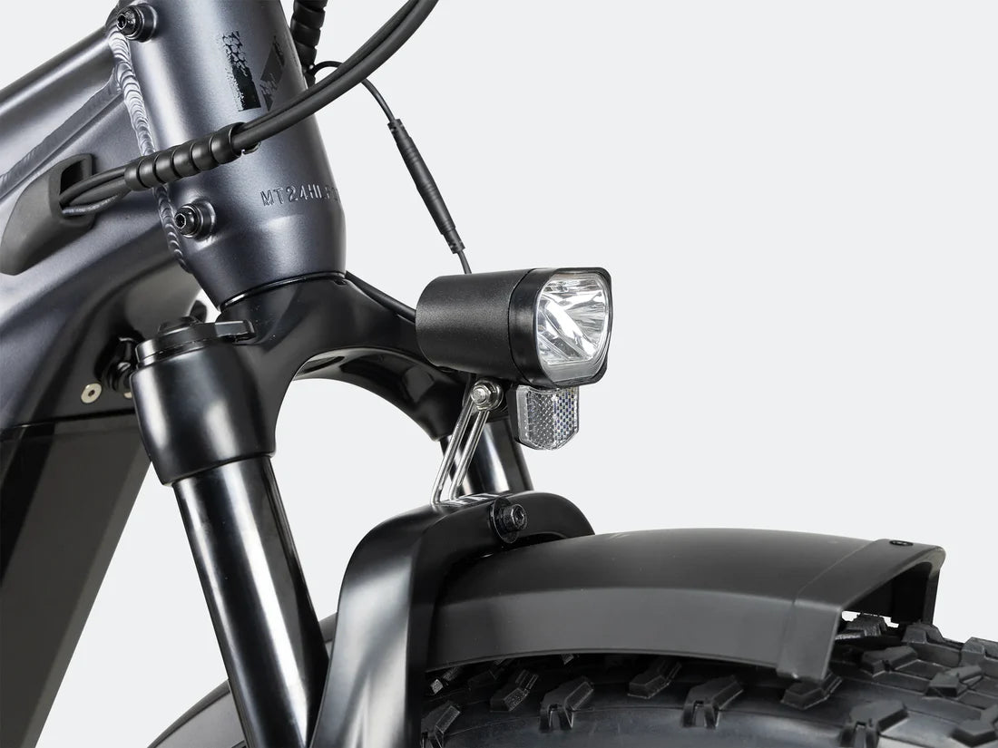 Velowave Ranger 3.0 Fat Tire All-Terrain Electric Bike Close-up of a motorcycle headlight and front suspension on a white background. Valowave Ranger 3.0 Fat Tire All-Terrain Electric Bike
