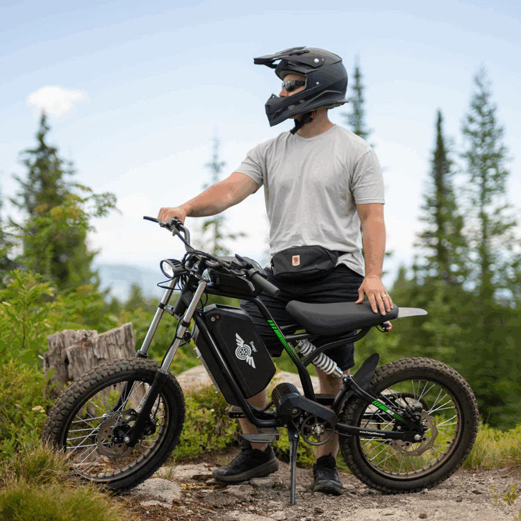 Freego Nova 3 Mid-Drive All-Terrain Dirt eBike Person on an electric bike in a forest setting. Freego Nova 3 Mid-Drive All-Terrain Dirt eBike