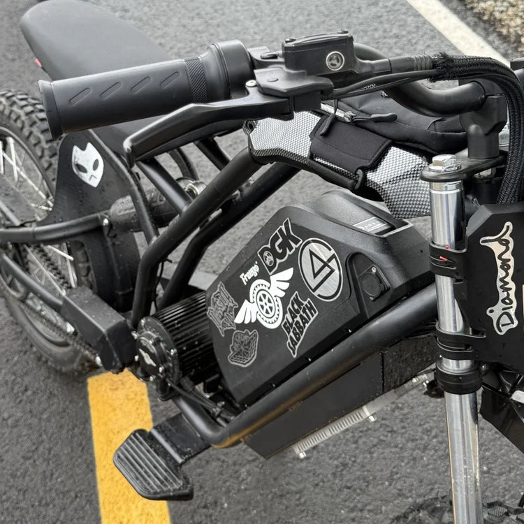 Freego Nova 5 Mid-Drive Off-Road Electric Dirt Bike Close-up of a motorcycle's handlebar with visible branding on the throttle housing. Freego Nova 5 Mid-Drive Off-Road Electric Dirt Bike