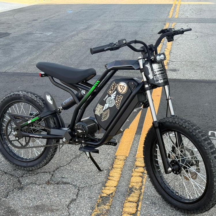 Freego Nova 3 Mid-Drive All-Terrain Dirt eBike Electric bike on a paved road with visible branding and design elements. Freego Nova 3 Mid-Drive All-Terrain Dirt eBike