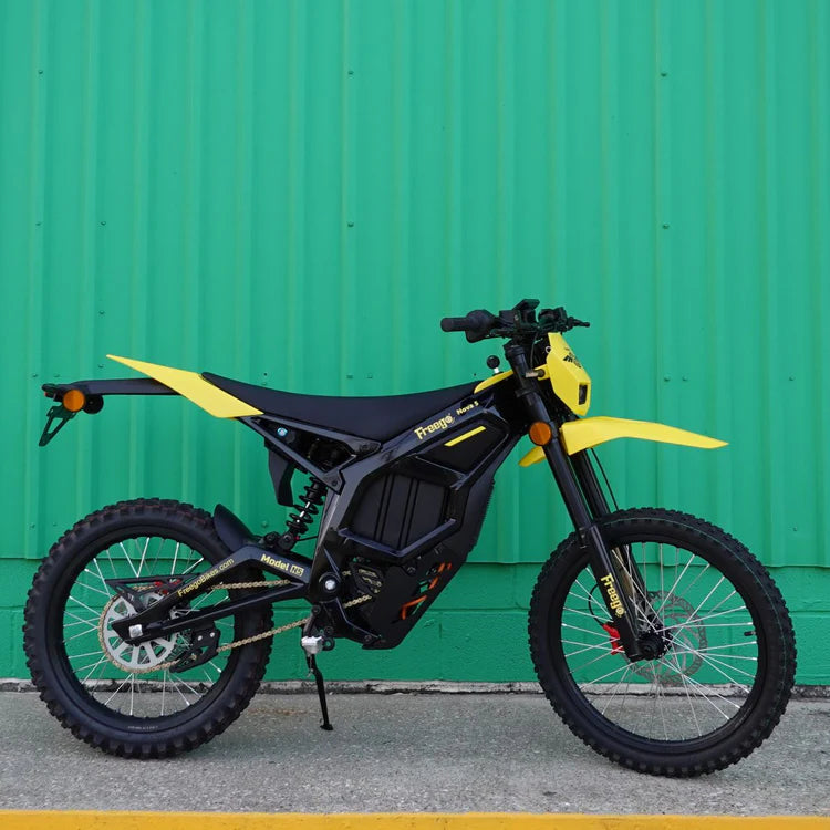 Freego Nova 5 Mid-Drive Off-Road Electric Dirt Bike Yellow and black electric bike against a green wall. Freego Nova 5 Mid-Drive Off-Road Electric Dirt Bike