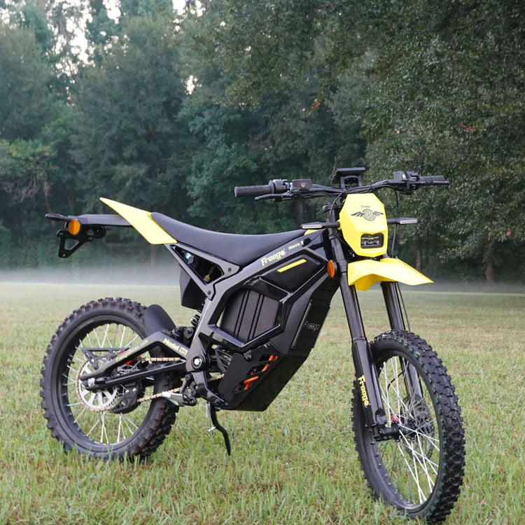 Freego Nova 5 Mid-Drive Off-Road Electric Dirt Bike Black and yellow electric bike on grass with trees in the background.Freego Nova 5 Mid-Drive Off-Road Electric Dirt Bike