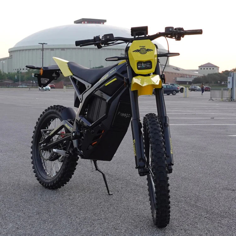 Freego Nova 5 Mid-Drive Off-Road Electric Dirt Bike Yellow and black electric bike in a parking lot with a building in the background. Freego Nova 5 Mid-Drive Off-Road Electric Dirt Bike