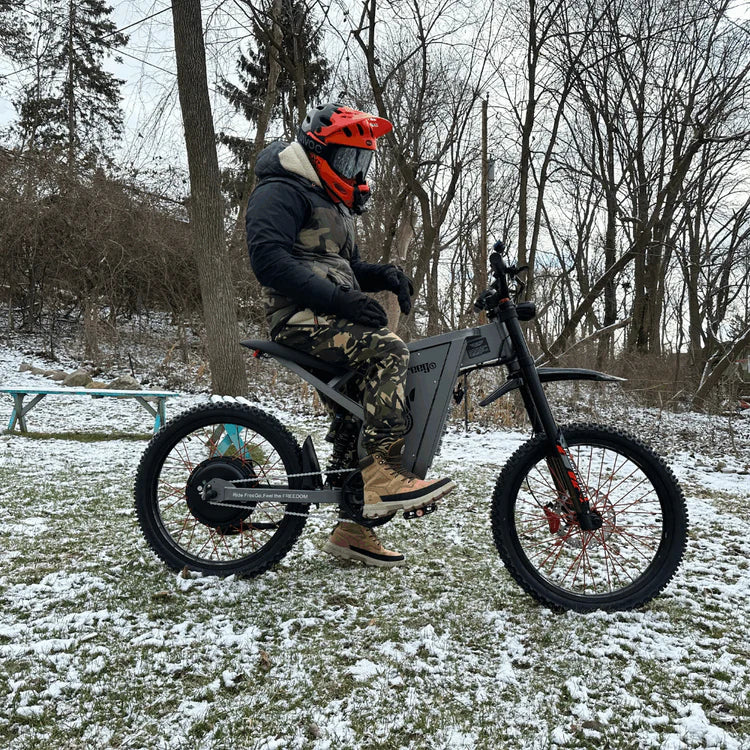 Freego X2 Pro All-Terrain Dirt eBike Person on a fat-tire bike in a snowy park setting. Freego X2 Pro All-Terrain Dirt eBike