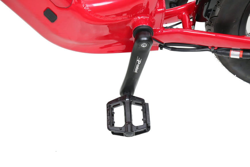 Close-up of a red motorcycle with a black foot peg on a white background. ACE Utility Cruiser EBike