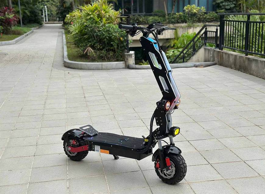 Electric scooter on a paved area with greenery in the background. Freego D11 Landtiger Electric Scooter Foldable Dual Motor 4000W