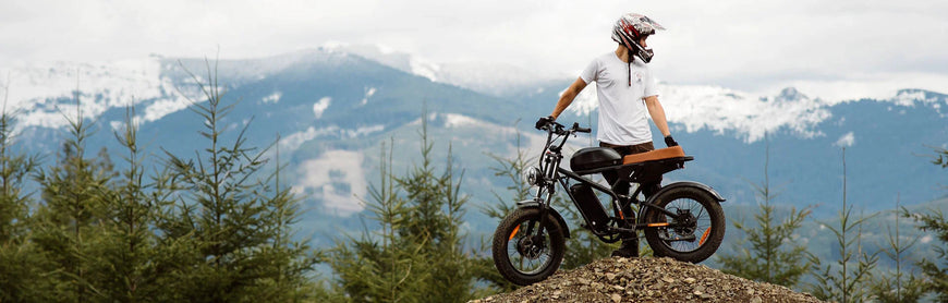 Person on a motorcycle with mountains in the background. Freego Flash F3 Pro Max Dual Motor and Battery eBike