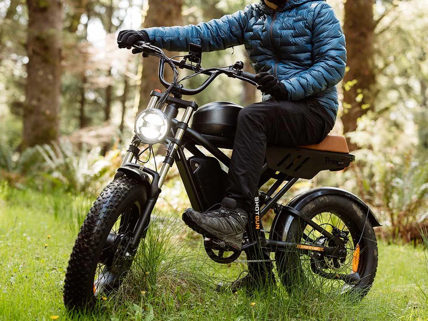 Person riding an electric bike in a forest setting, Freego Flash F3 Pro Max Dual Motor and Battery eBike