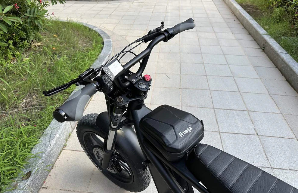 Black electric scooter with 'Yuba' branding on a paved path. Freego Shotgun F2 Pro Max Prime Fat Tire E-Bike