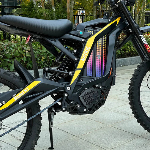 Black and yellow electric bike with visible branding on a paved surface. Natkie N1 All-Terrain Electric Motorcycle