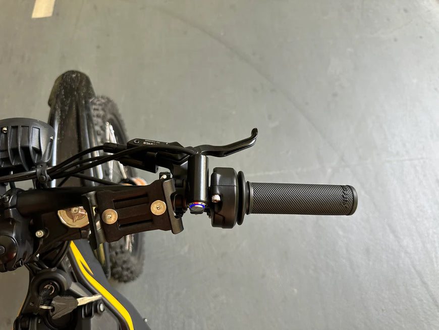 Close-up of a bicycle handlebar with a blurred background. Natkie N1 All-Terrain Electric Motorcycle