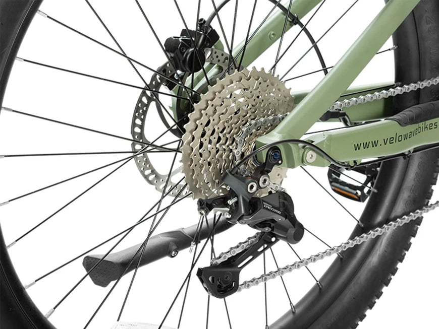 Close-up of a bicycle's gear system branding. Valowave Forest XM MTB