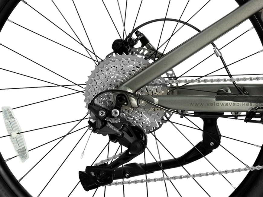 Close-up of a bicycle's gear system with a white background. Valowave Forest SM MTB