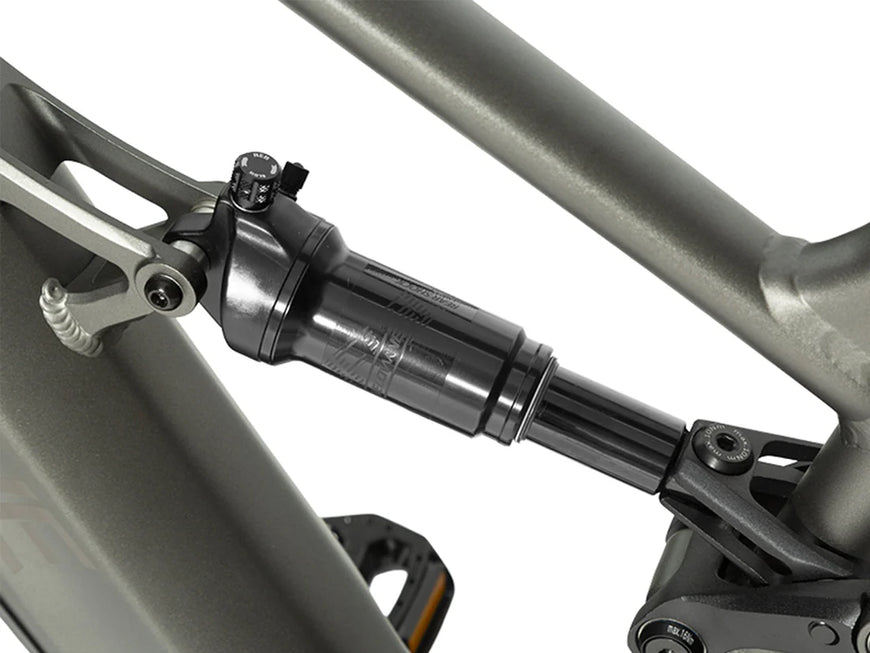 Close-up of a motorcycle suspension system on a white background. Valowave Forest SM MTB