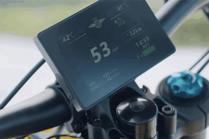 Close-up of a motorcycle digital display showing speed and temperature. Freego Nova 5 Mid-Drive Off-Road Electric Dirt Bike